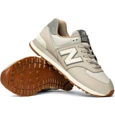 New Balance 574 trainers in dark