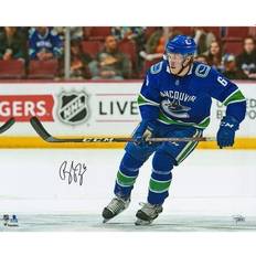 Brock Boeser Vancouver Canucks Autographed x Blue Jersey Skating Photograph