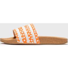 Adidas ADILETTE W orange female Sandals & now available at BSTN in