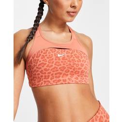 Nike Training Swoosh Dri-FIT leopard print cross back mid support sports bra in pink-Red
