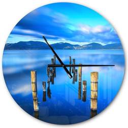 Design Art Wooden Pier Remains in Blue Sea Wall Clock 23"